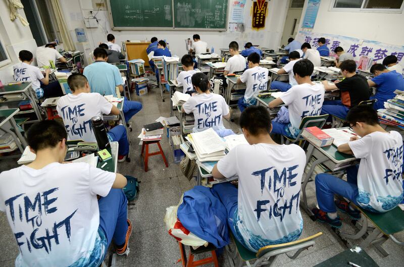 Students study in the evening ahead of the annual national college entrance examination at a high school in Handan, Hebei province, China May 23, 2018.