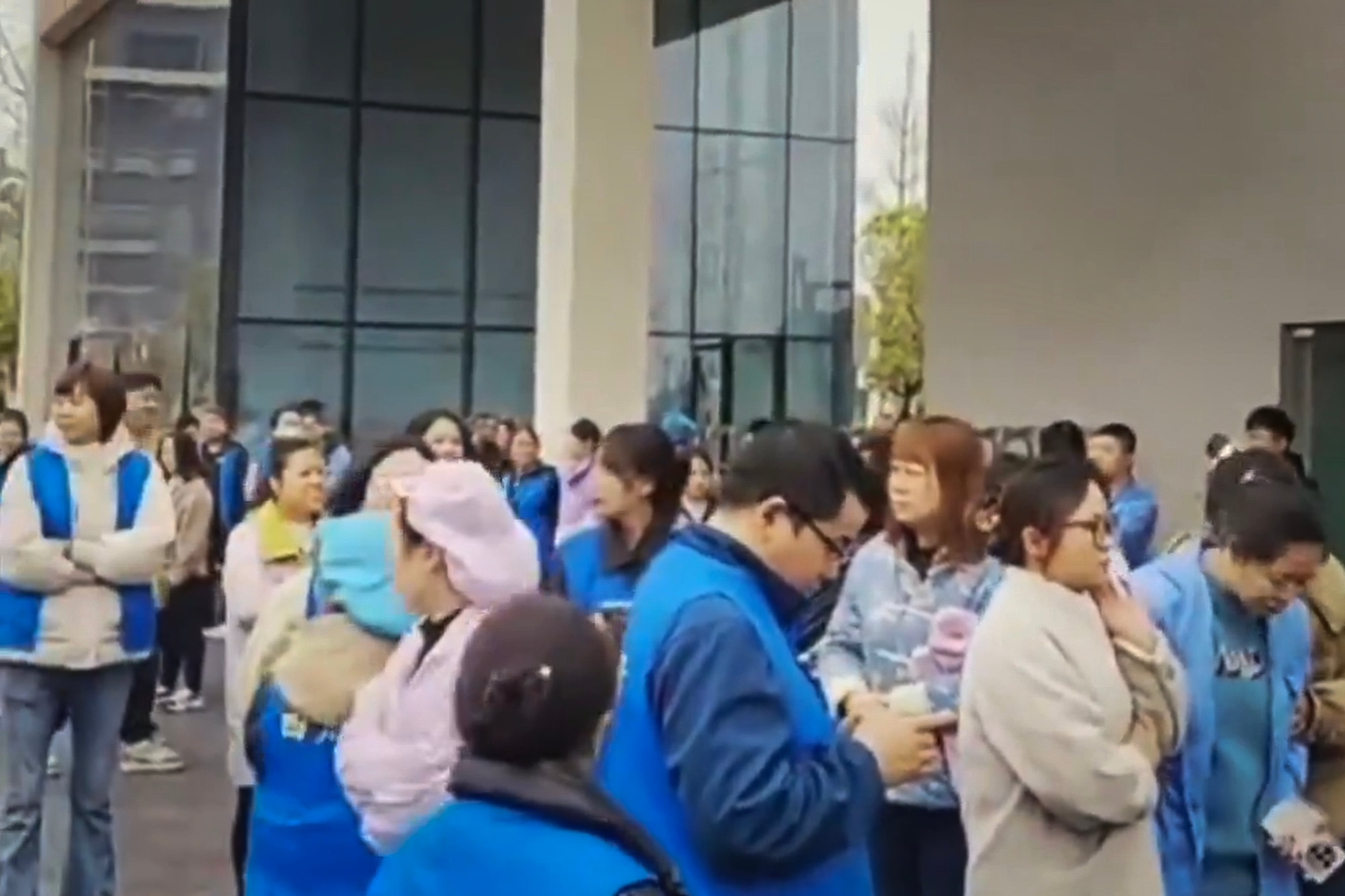 Protests by unpaid Chinese workers spread amid factory closures